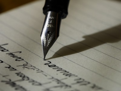 notebook writing hand pen